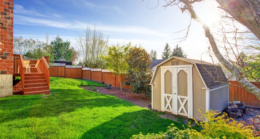 Fenced backyard with storage shed in Helena